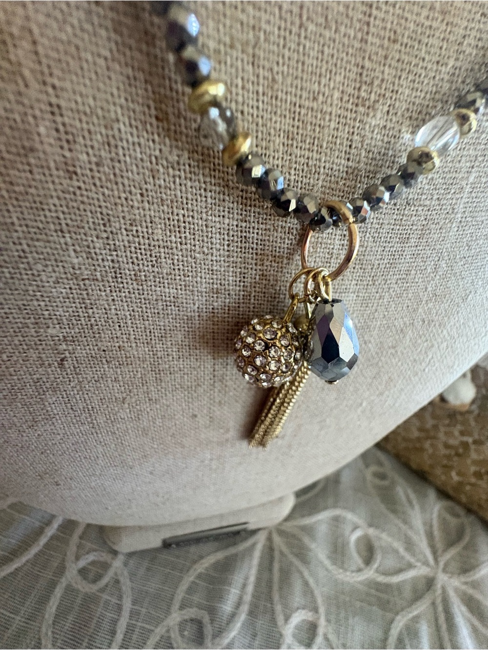 Gold and Hematite Beaded Charm and Tassel Stretch Necklace